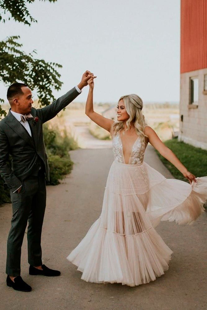 Twirl-Worthy Dress With Deep Decollete #sexyweddingdress #stylishweddingdress