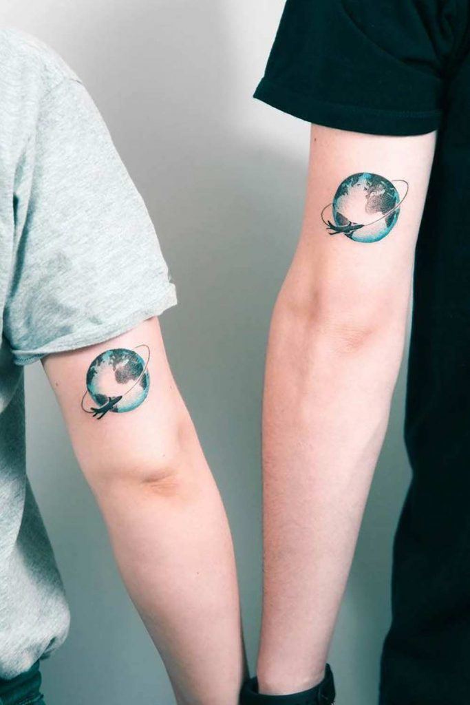 Couple Tattoos with Planet for Travelers
