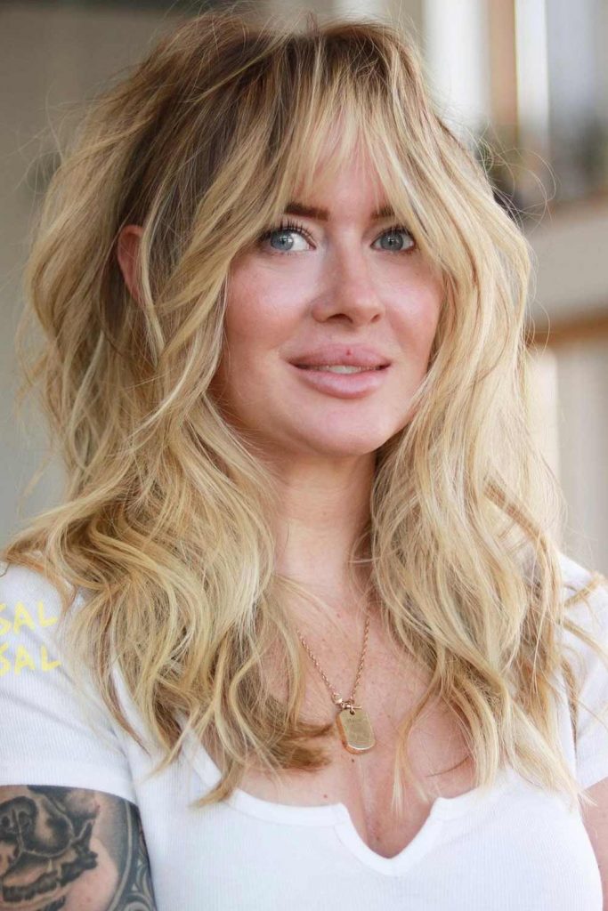 Blonde Hair With Edgy Curtain Bangs