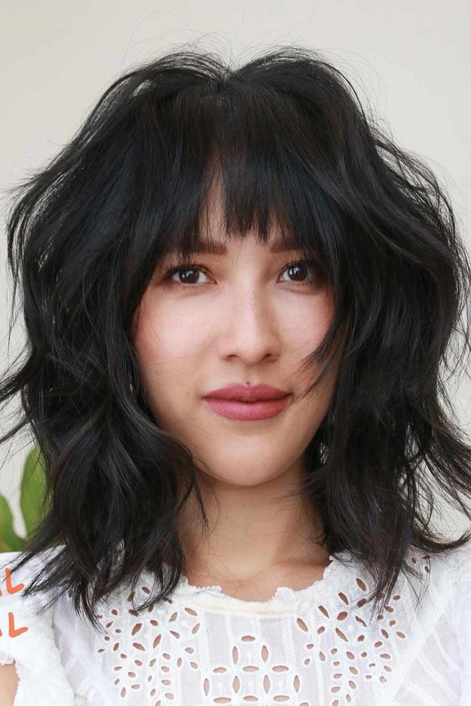 Dark Voluminous Hair with Bangs