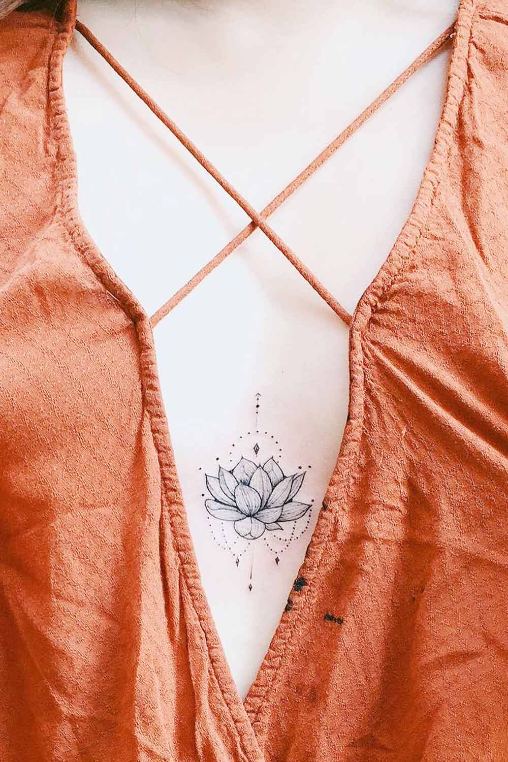 Small Sternum Lotus Tattoo